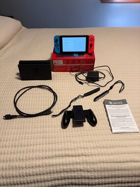 Nintendo Switch with Neon Blue & Neon Red Joy‑Con and Accessories